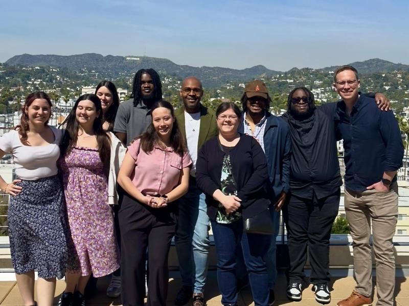 Oswego students and faculty stand in front of the Hollywood sign on their Hollywood POV trip.