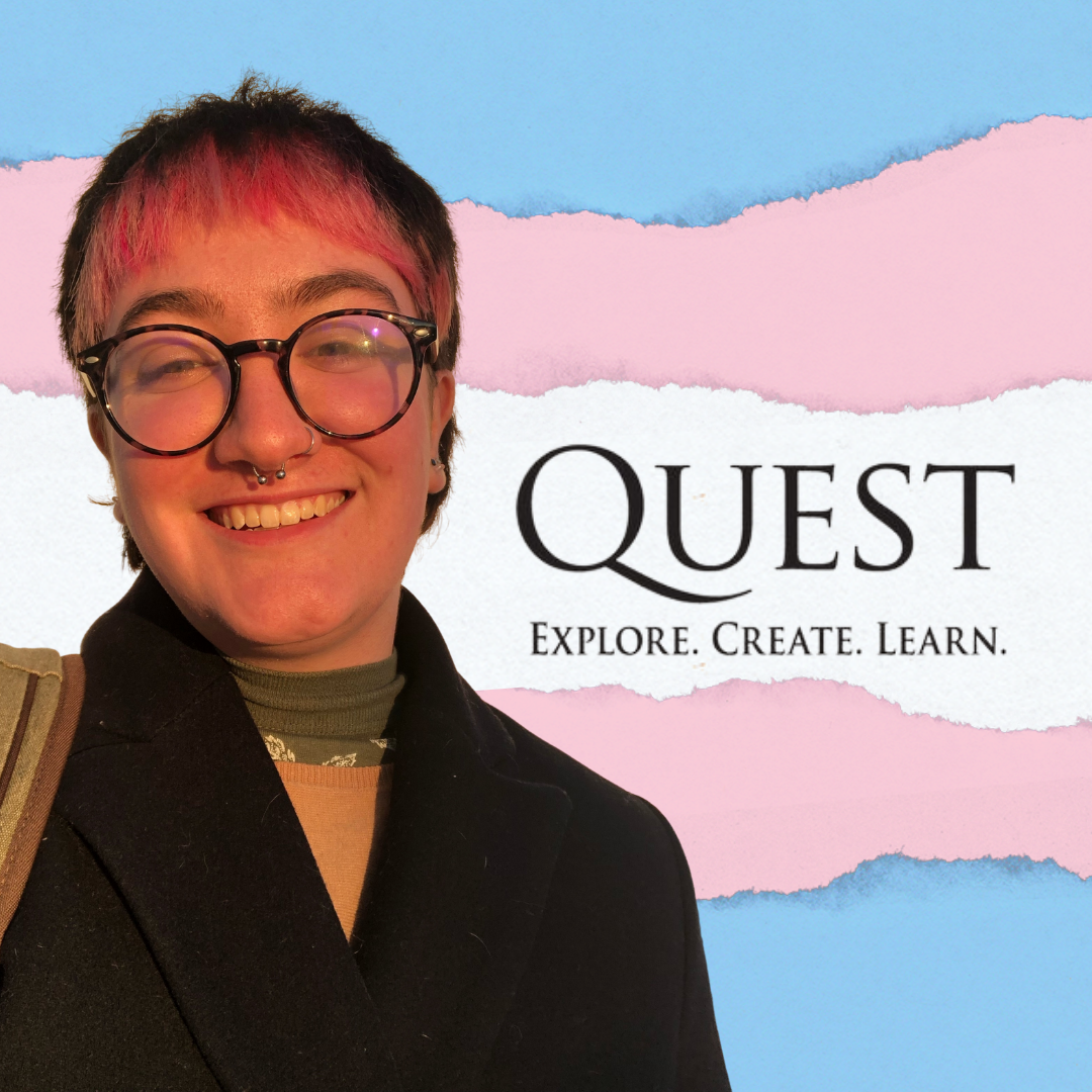 Senior Micah Audycki in front of a trans pride flag for Quest Day presentation