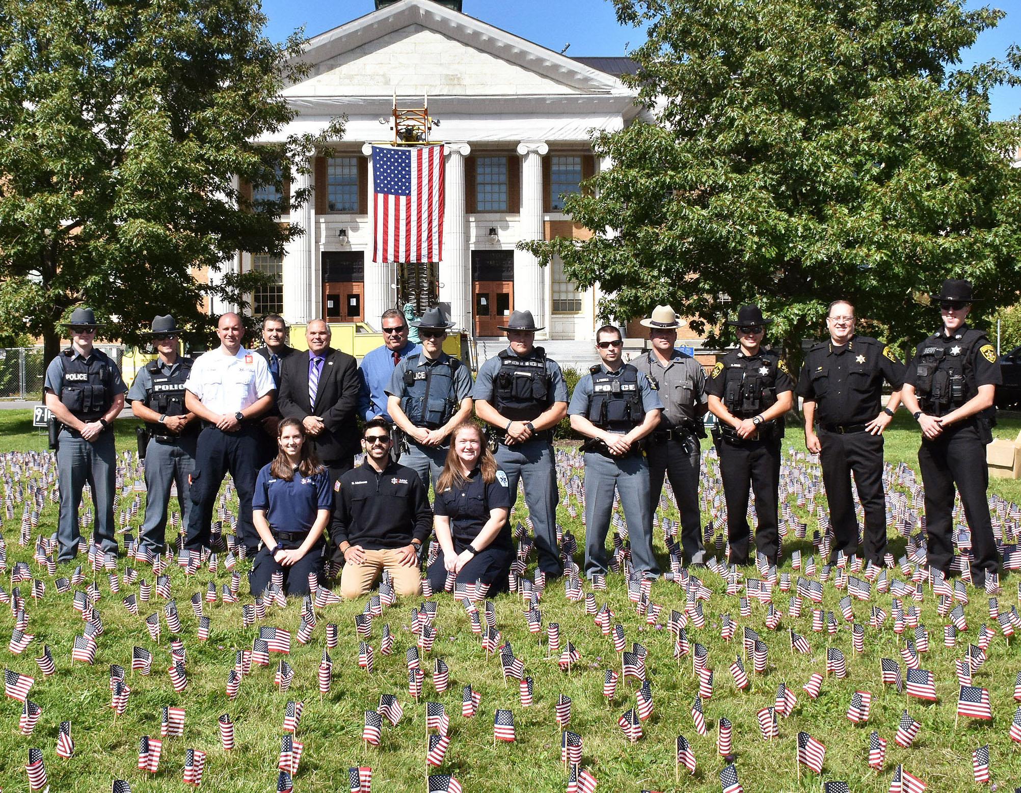 University Police and local law enforcement and first responders participated in this year's effort to plant 2,996 flags in front of Sheldon Hall to remember the lives lost in the Sept. 11, 2001 terrorist attacks.