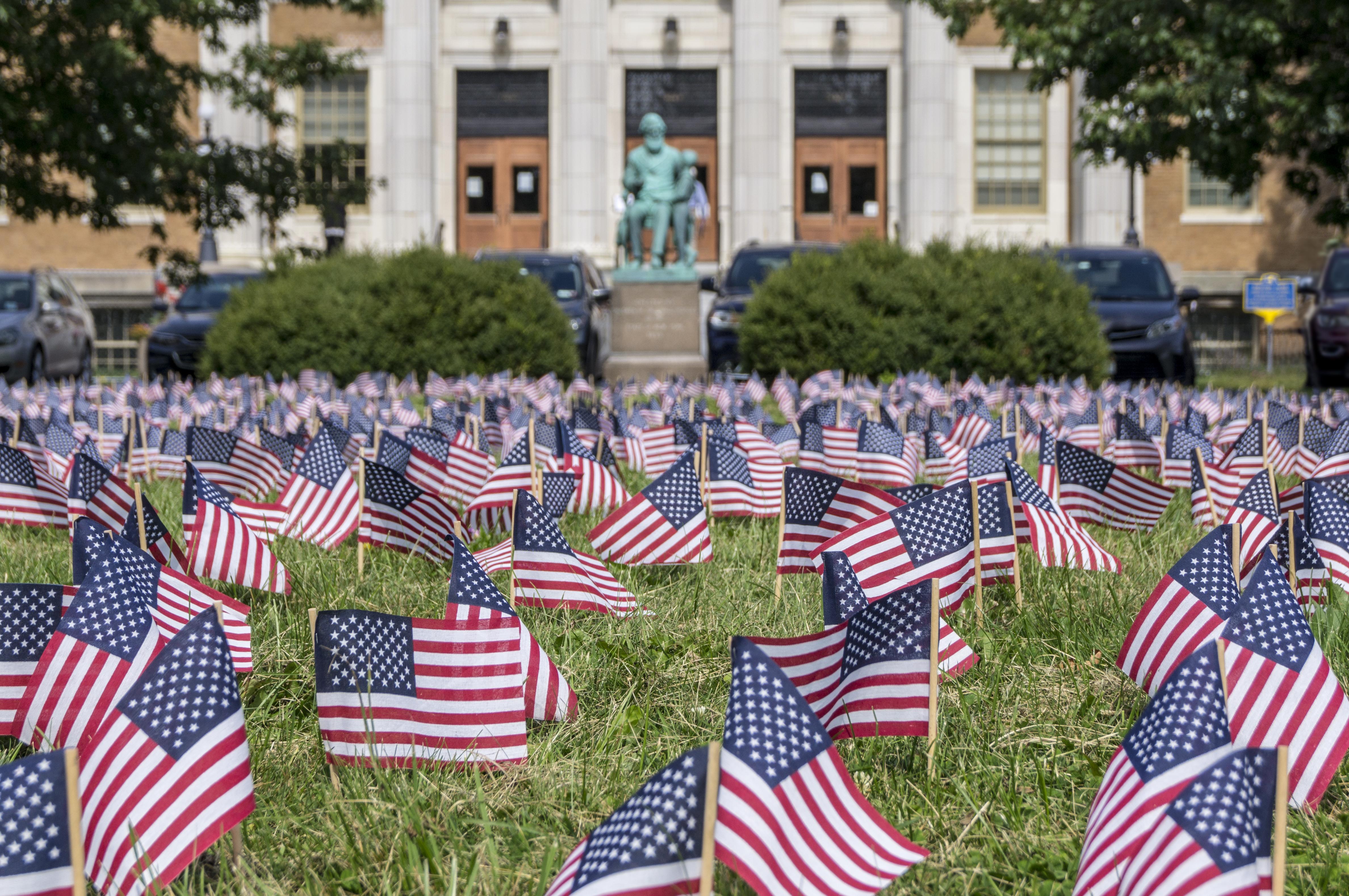 Students, veterans, first responders, faculty, staff, administrators and community members planted 2,996 flags on the front lawn of Sheldon Hall to remember every person killed in the 9/11 terrorist attacks