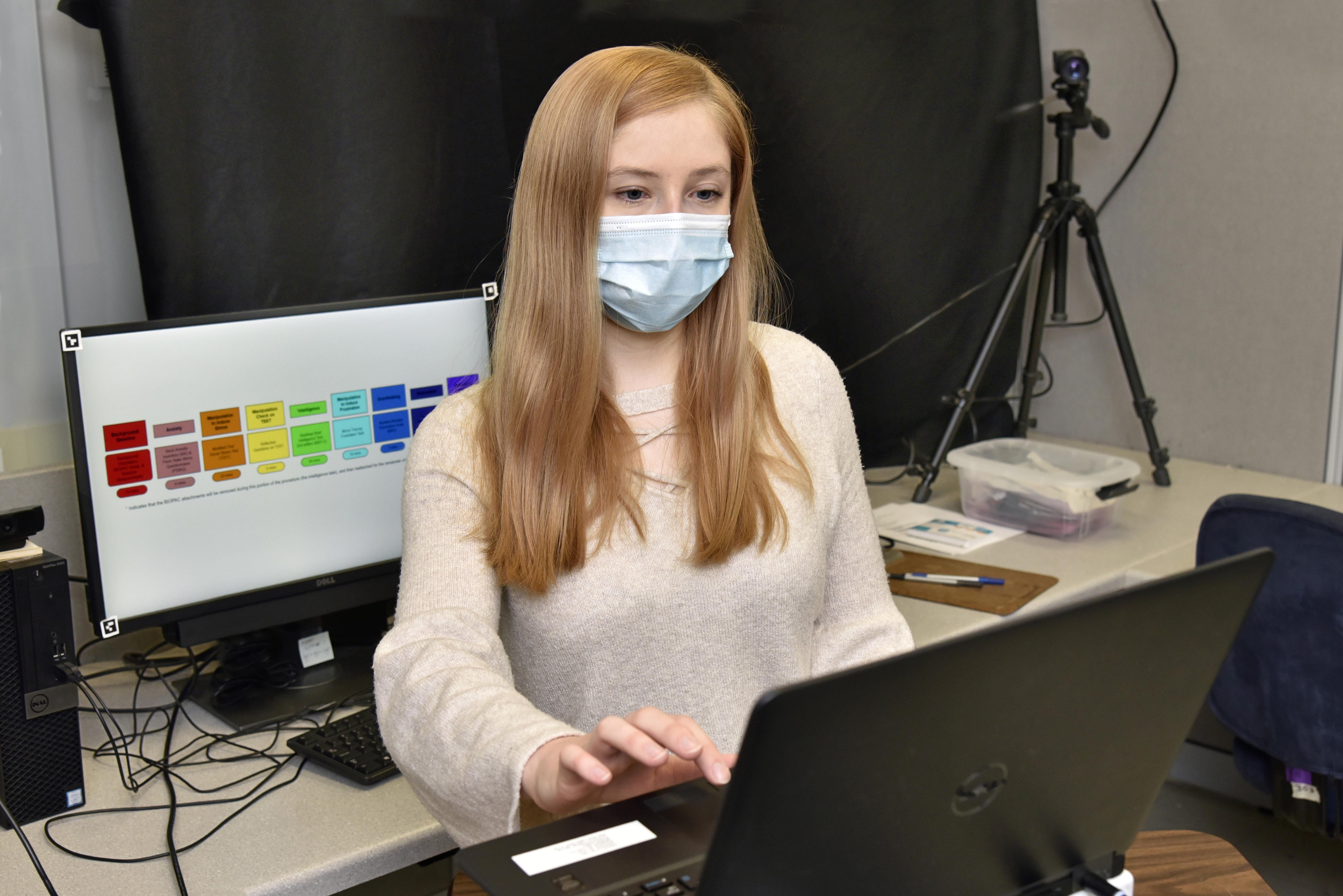 Psychology student Quinn Ceilly works in a Mahar Hall lab