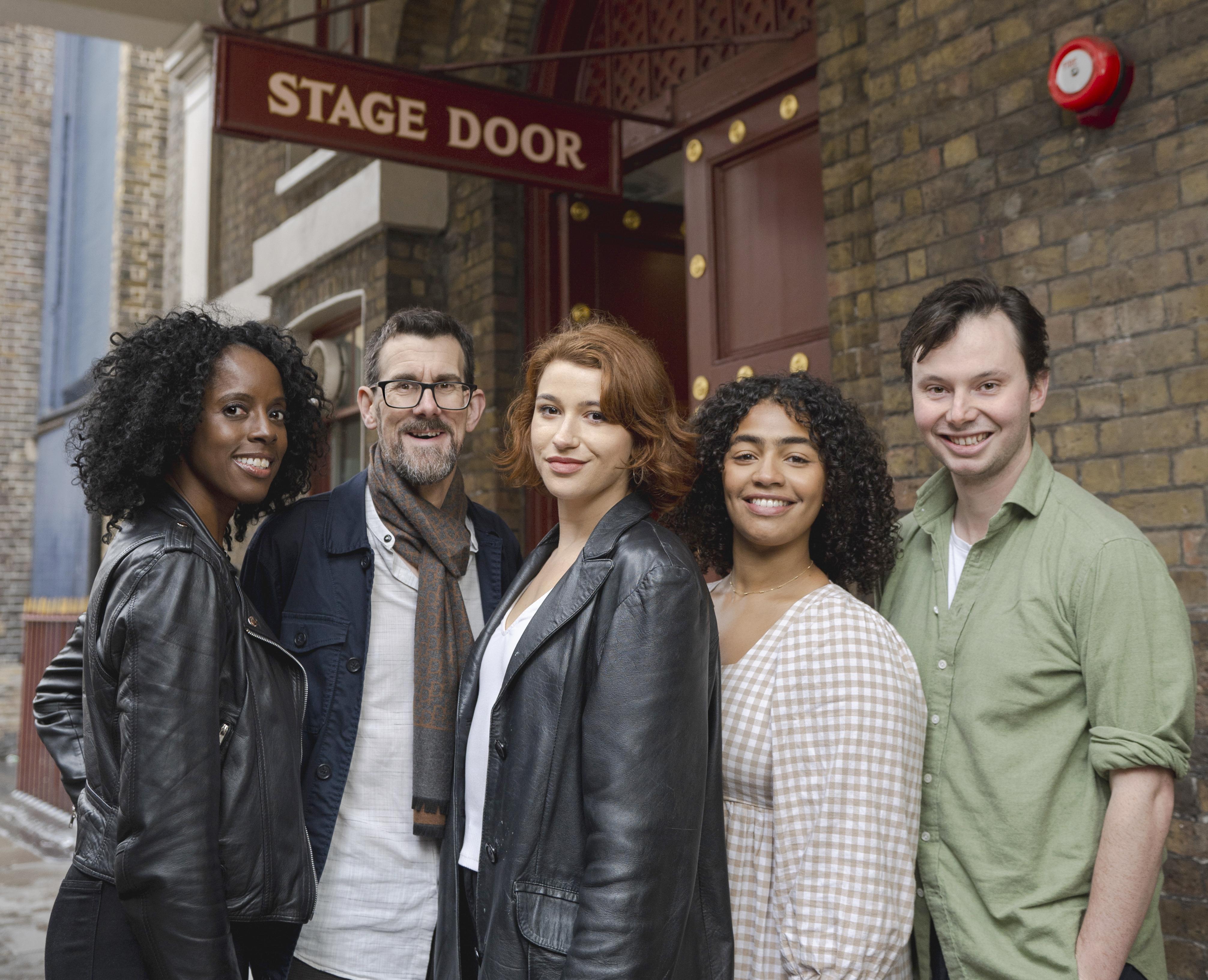 5 members of Actors from the London Stage pose outside a stage door
