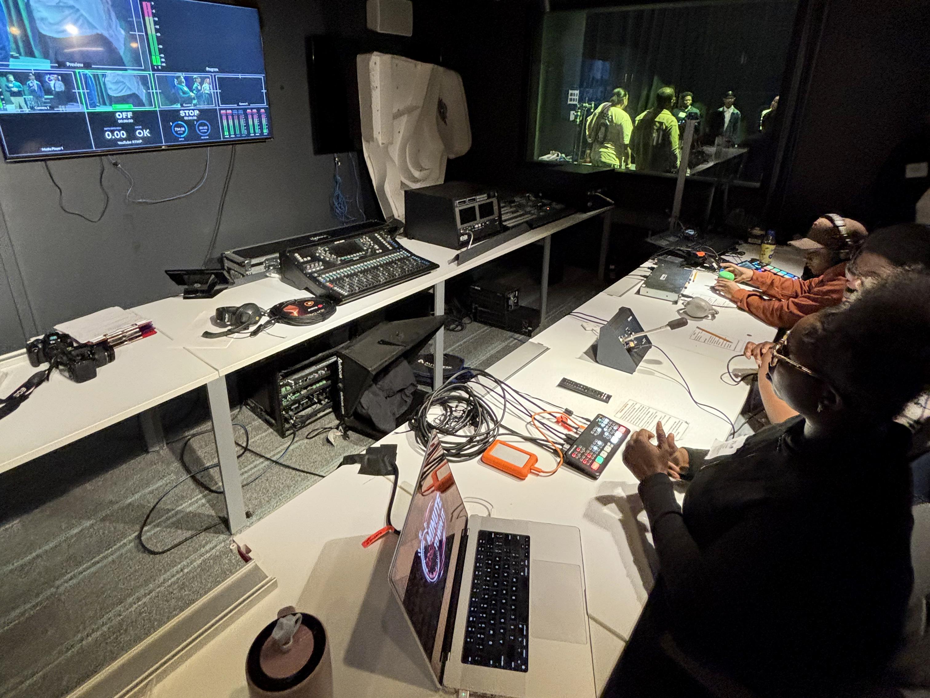 Students work in a broadcast control room