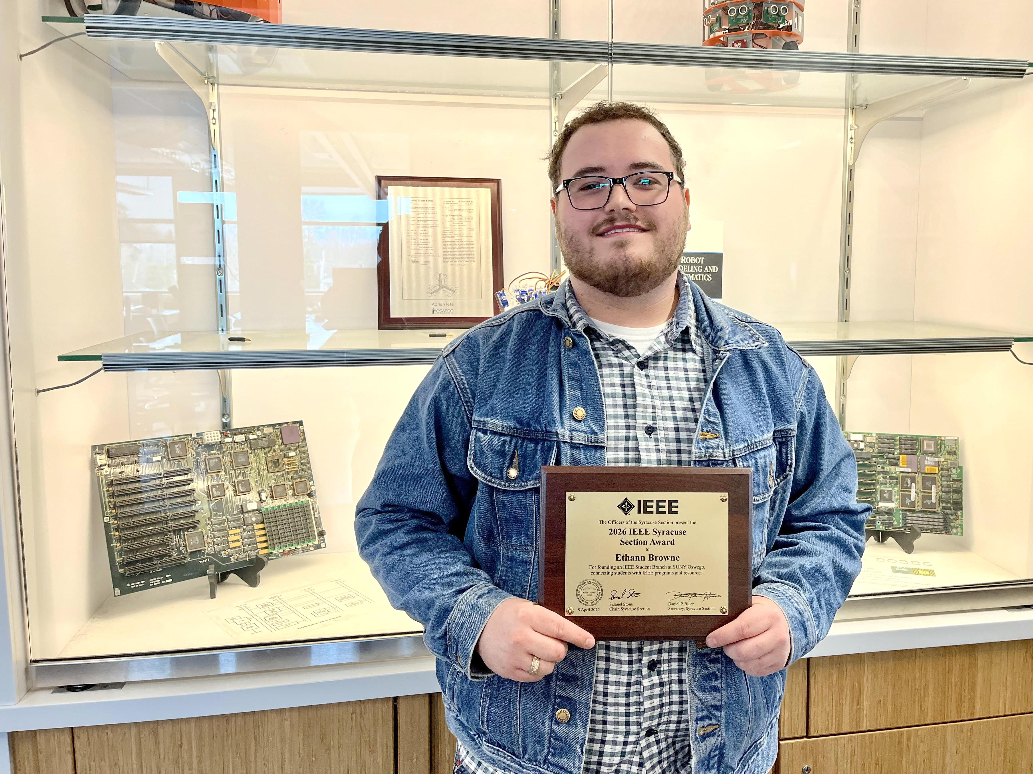 Senior electrical and computer engineering major Ethann Browne recently earned the 2026 IEEE Syracuse Section Award from the regional Institute of Electrical and Electronics Engineers for helping found and lead Oswego's vibrant student chapter.