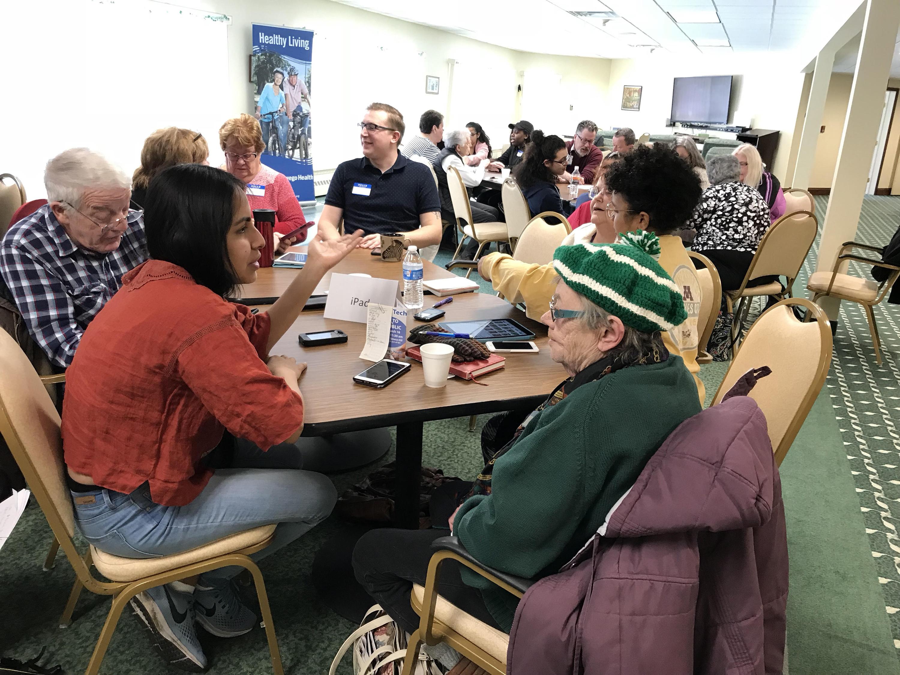 Students participate in a local community outreach effort to spend time with senior citizens at Springside at Seneca Hill and help them become more technically savvy