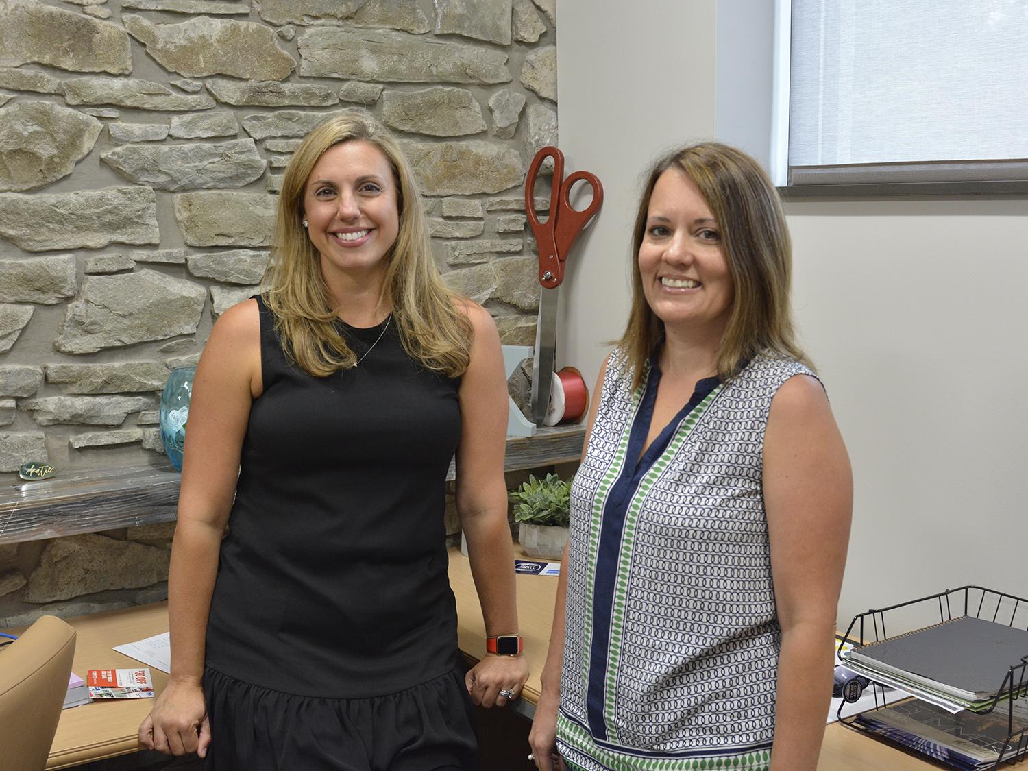 Katie Toomey (left), executive director of the Greater Oswego-Fulton Chamber of Commerce, and Chena Tucker, director of the SUNY Oswego Office of Business and Community Relations.
