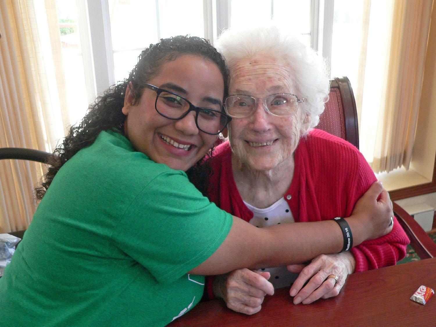 Oswego students doing English immersion program bonded with local Bishop's Commons seniors