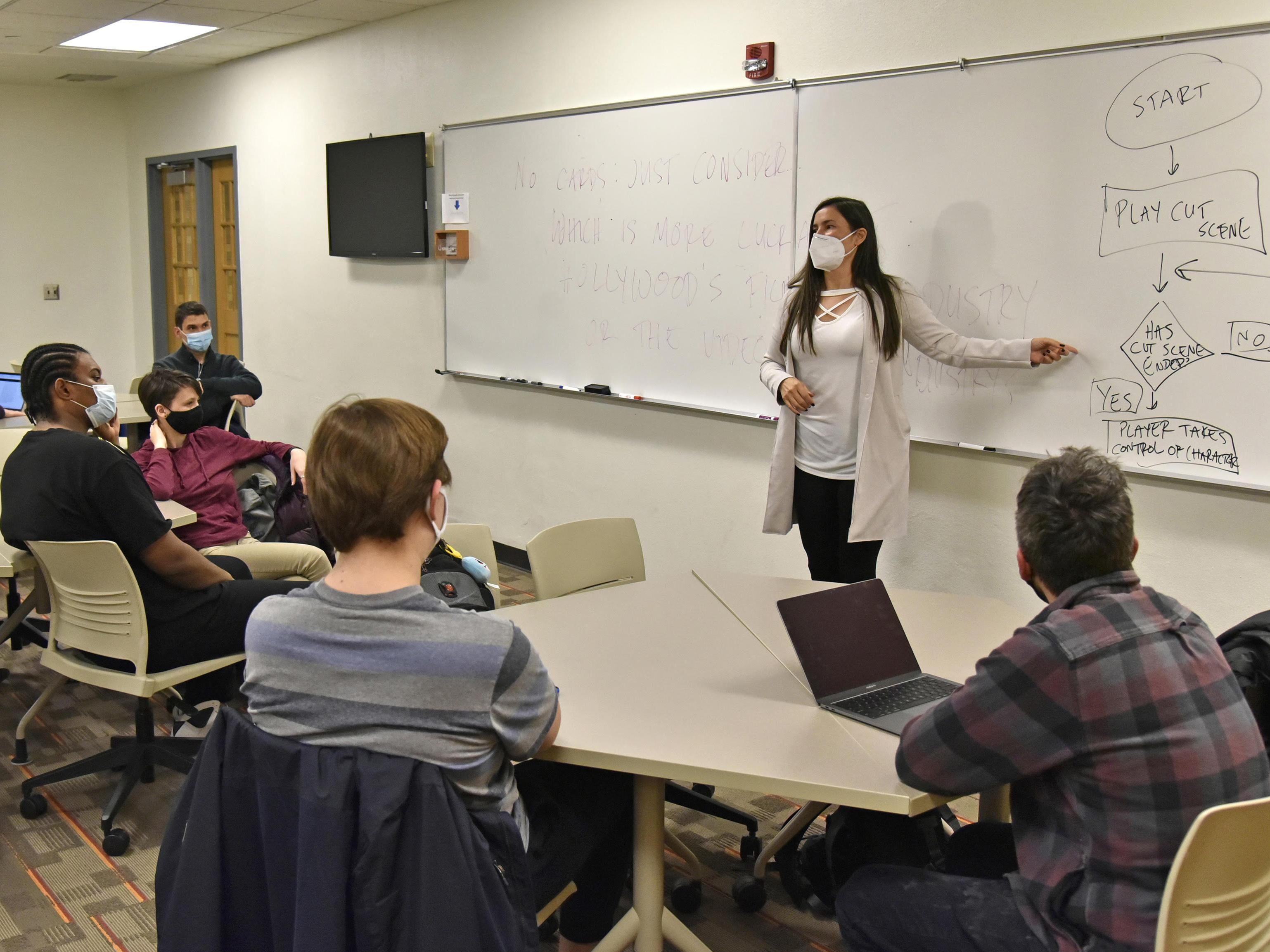 Faculty member Soma Mei Sheng Frazier works with students in her Creative Writing 313 class, which is part of the Subnivean literary magazine project.