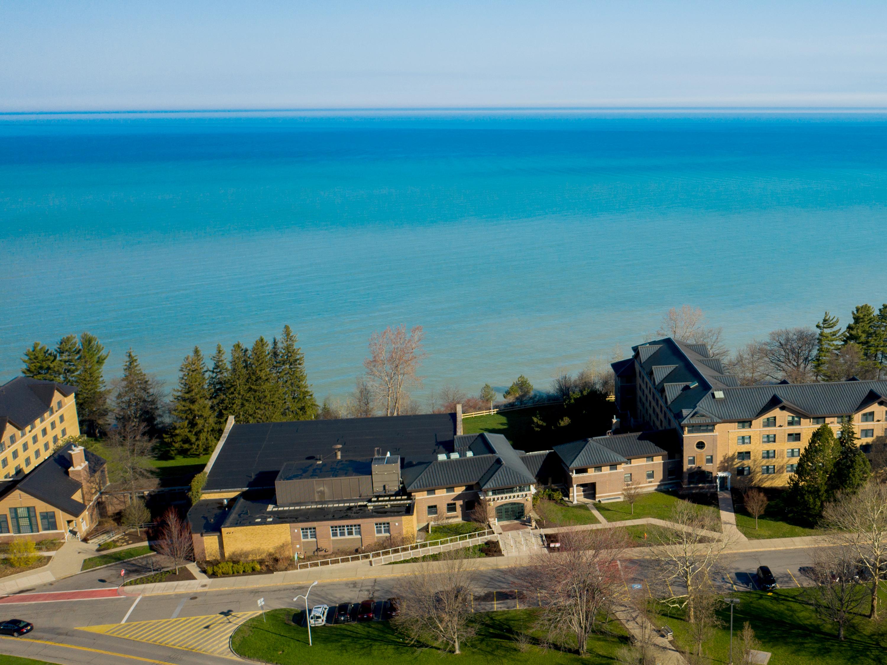 Aerial view of Lake Ontario and campus buildings