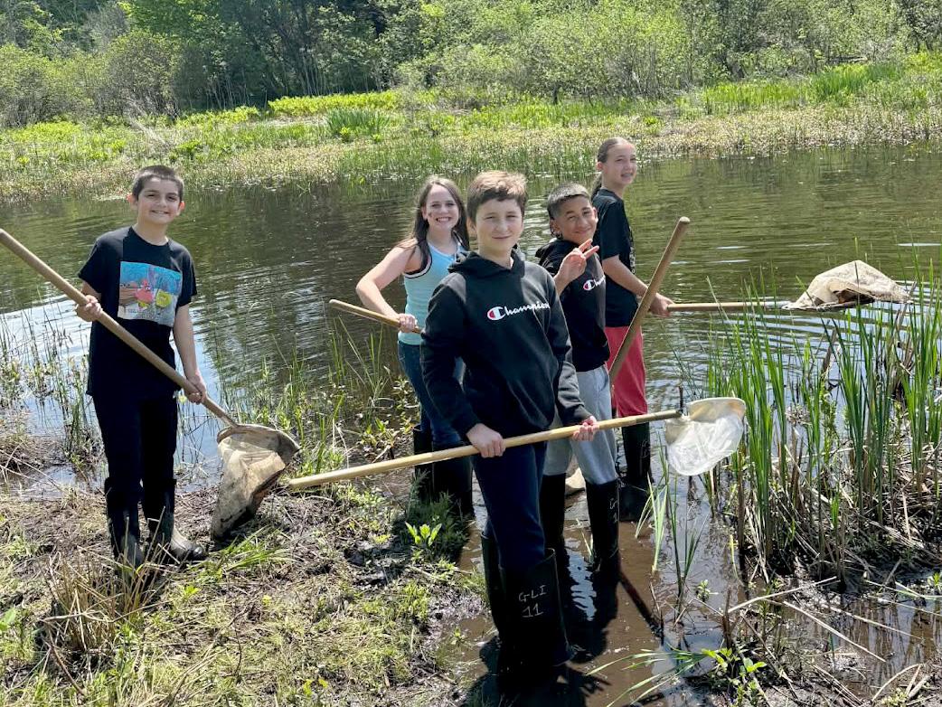 Students from Granby Elementary School explore the wetlands at Rice Creek Field Station