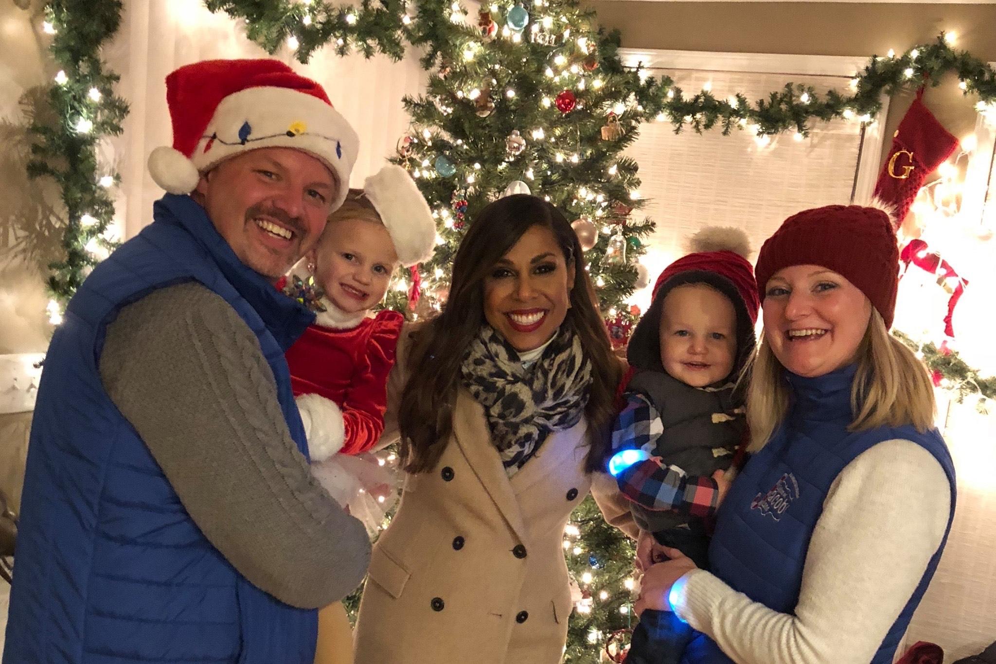 Brewster family with ABC Great Christmas Light Fight host Taniya Nayak (center)