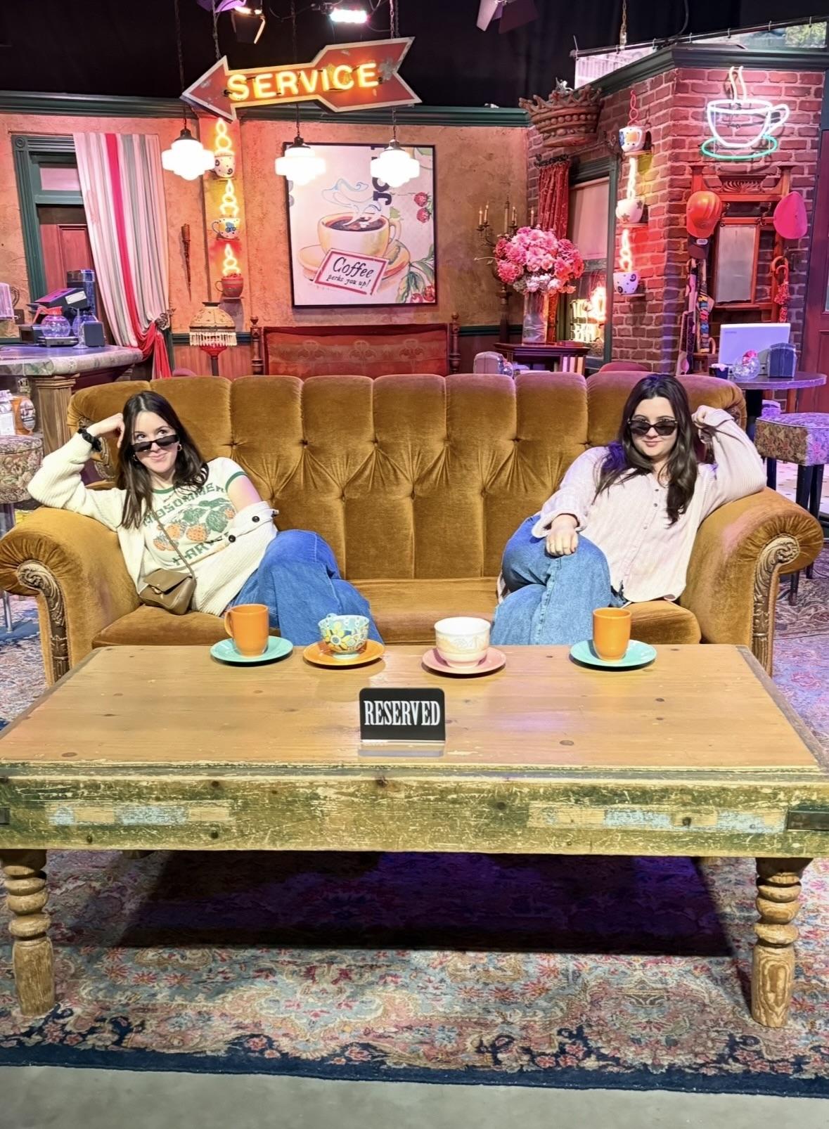 Oswego students Madison Gordon (left) and Samantha Citarell visit the set of "Friends" on their class tour of Warner Bros.