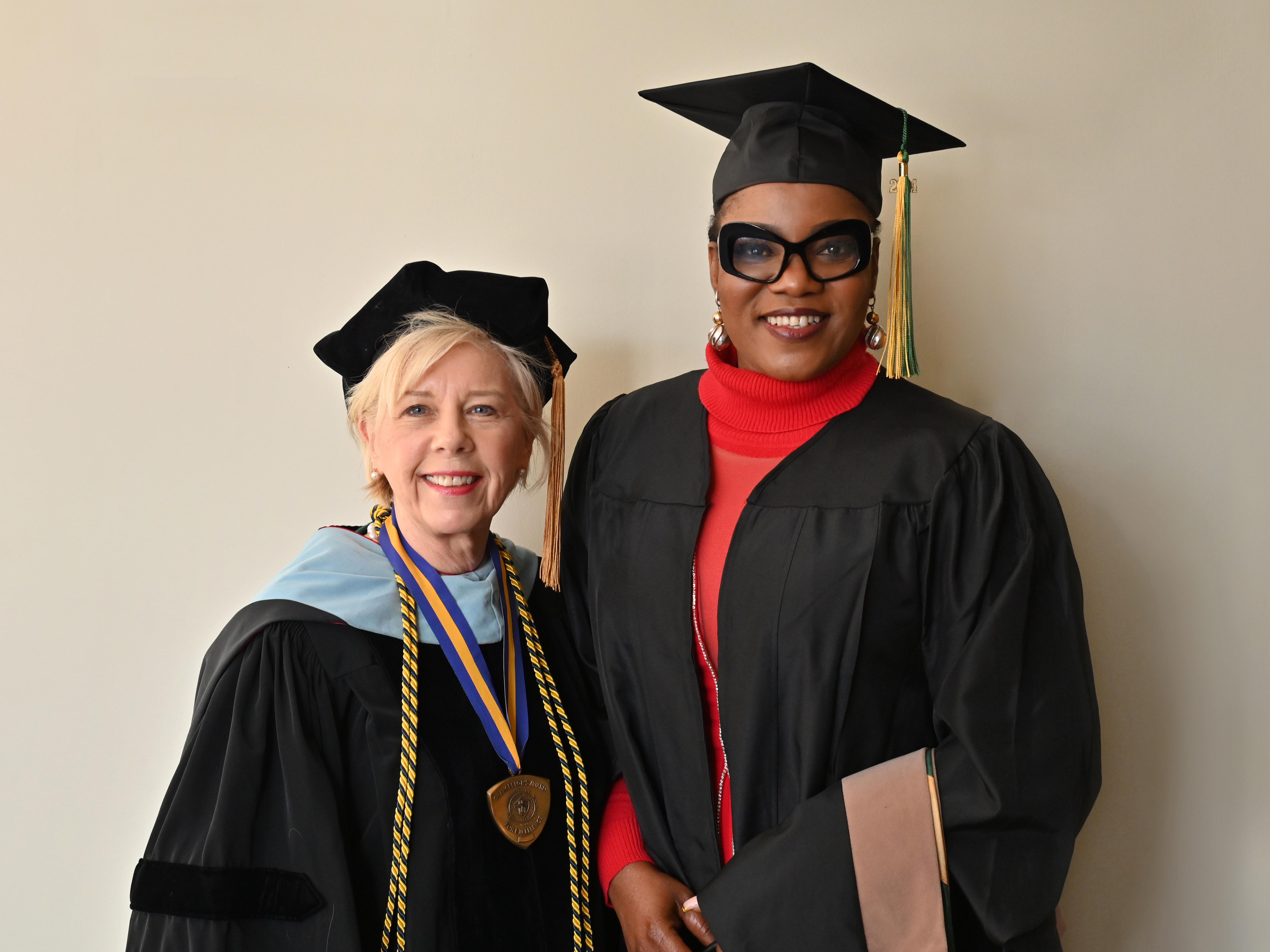 Irene Scruton, assistant dean of the School of Business and director of Oswego’s MBA programs, congratulates December 2024 online MBA graduate Jane Nwagu, the group head of business development for FBN Insurance Brokers in Lagos, Nigeria. 