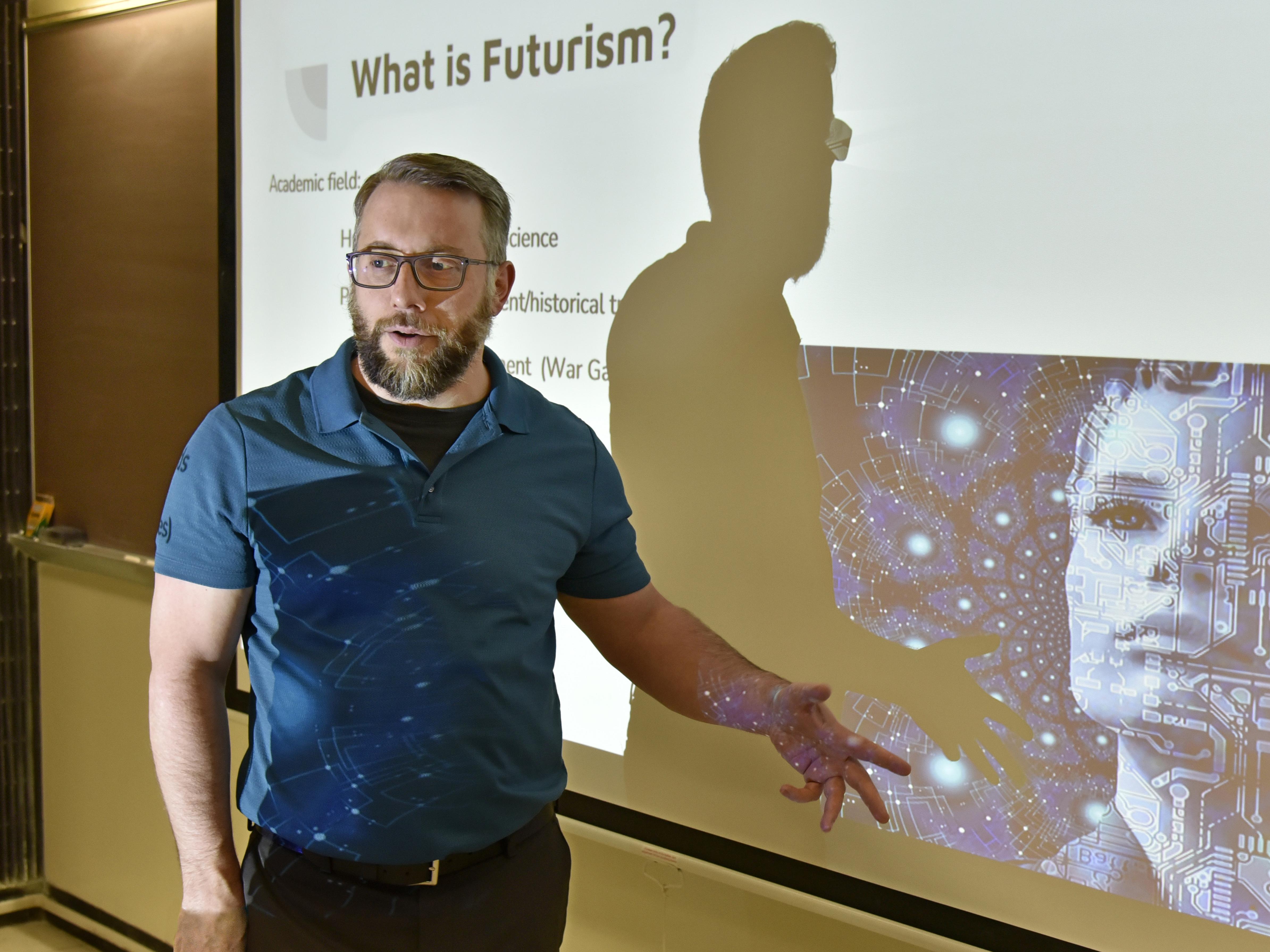 Jason Zenor teaching about futurism, connecting with his expertise on legal and ethical issues related to artificial intelligence