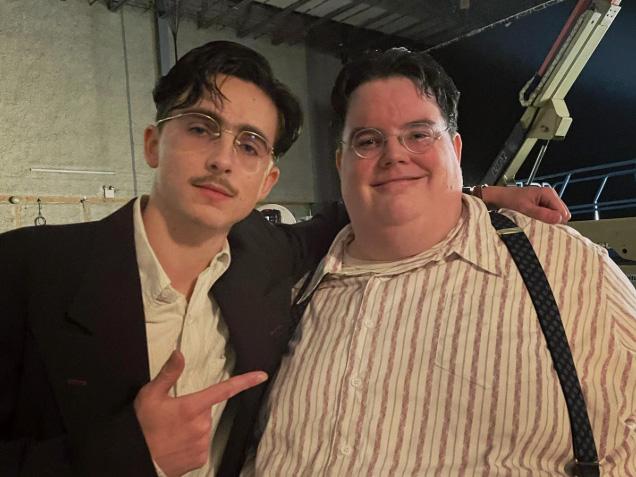 2015 alumnus Luke Manley (right) on the set of "Marty Supreme" with Timothee Chalamet