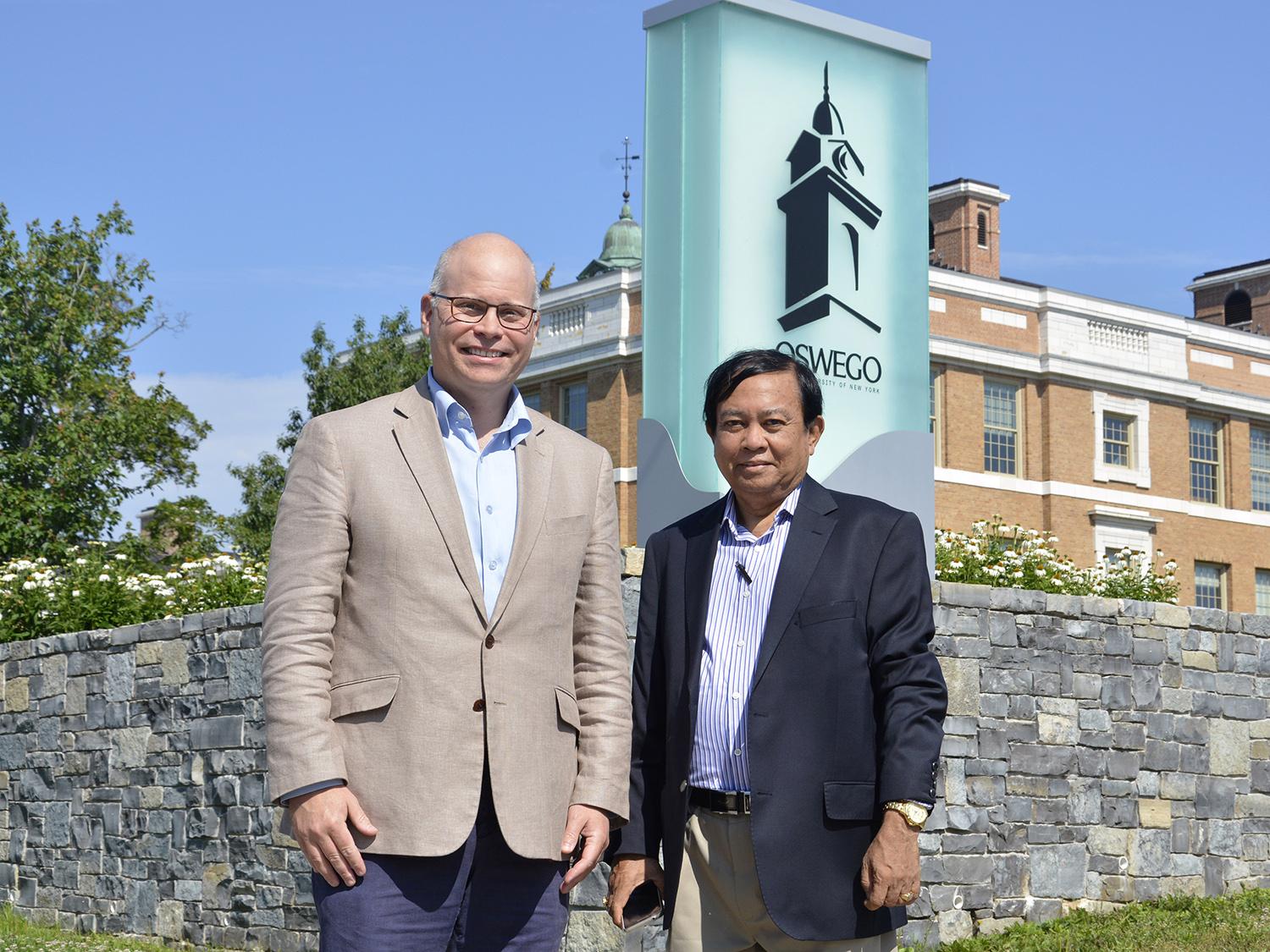 Dr. Joshua McKeown (left), director of SUNY Oswego's Office of International Education and Programs, mentors physician and educator Dr. Myint Oo, who recently traveled from Myanmar to learn more about fostering international education opportunities