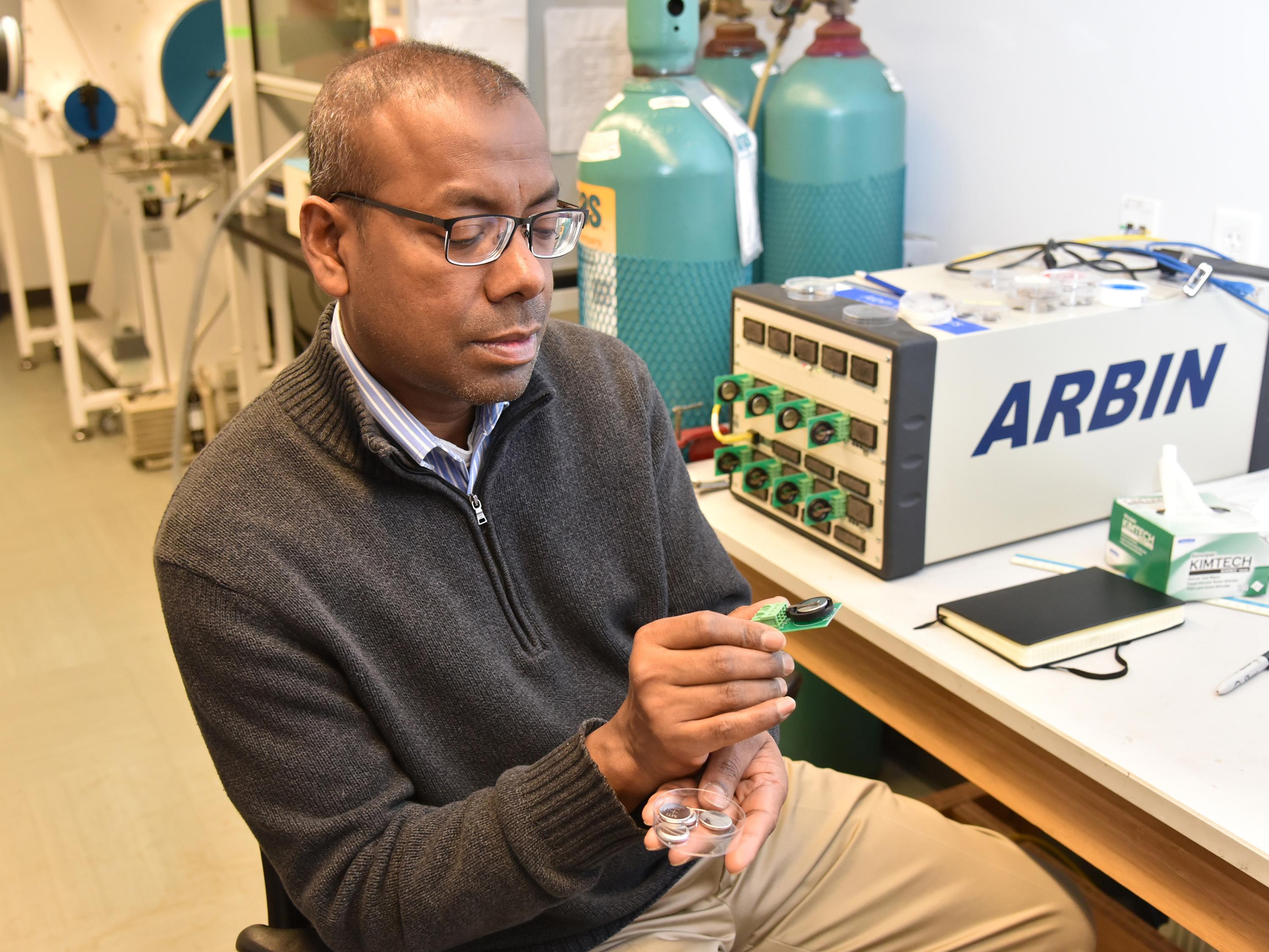Professor Mohammad Islam showcases his sustainable batteries in the Shineman Center physics lab.