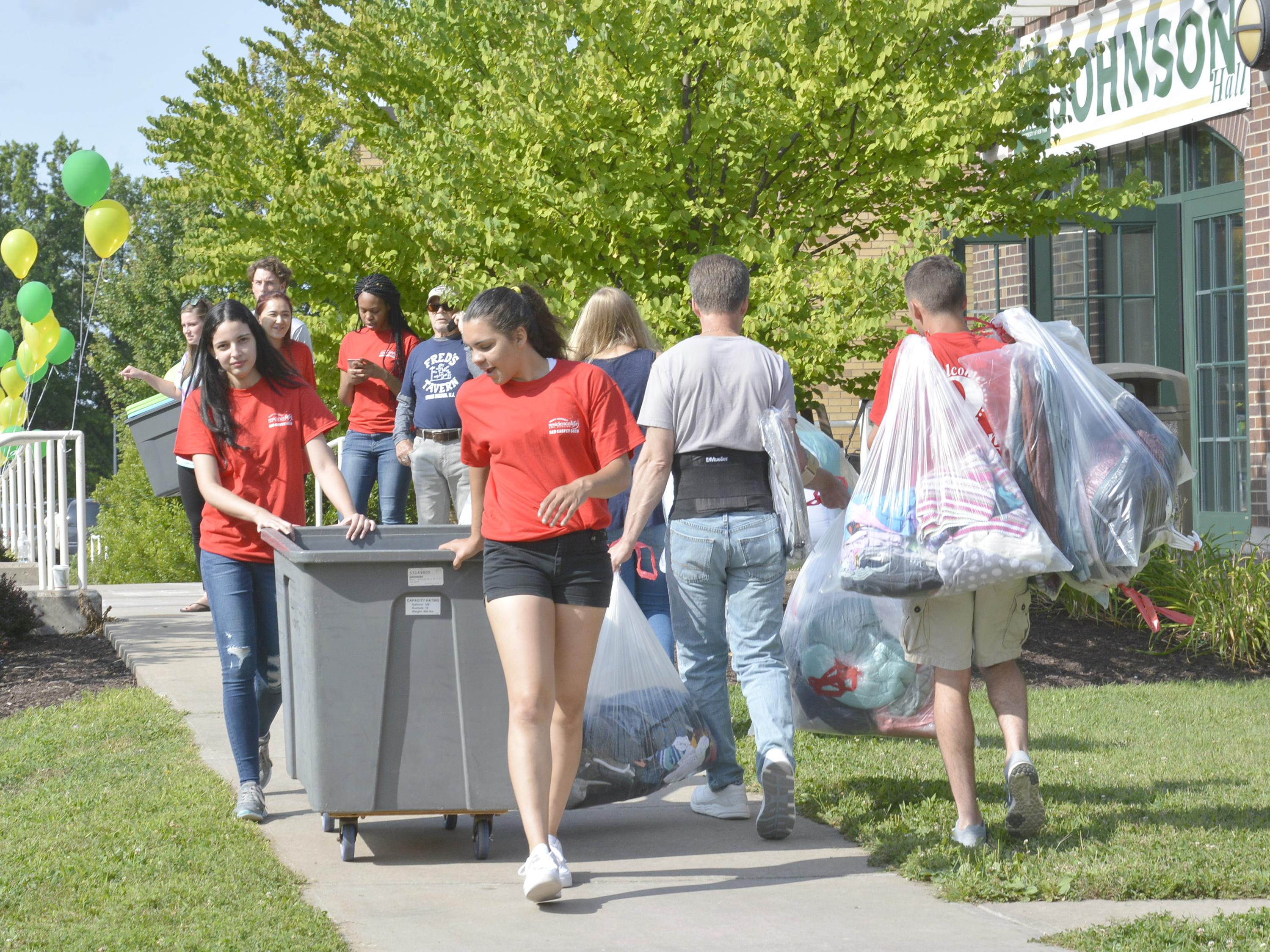Red Carpet Crew members help move new students onto campus