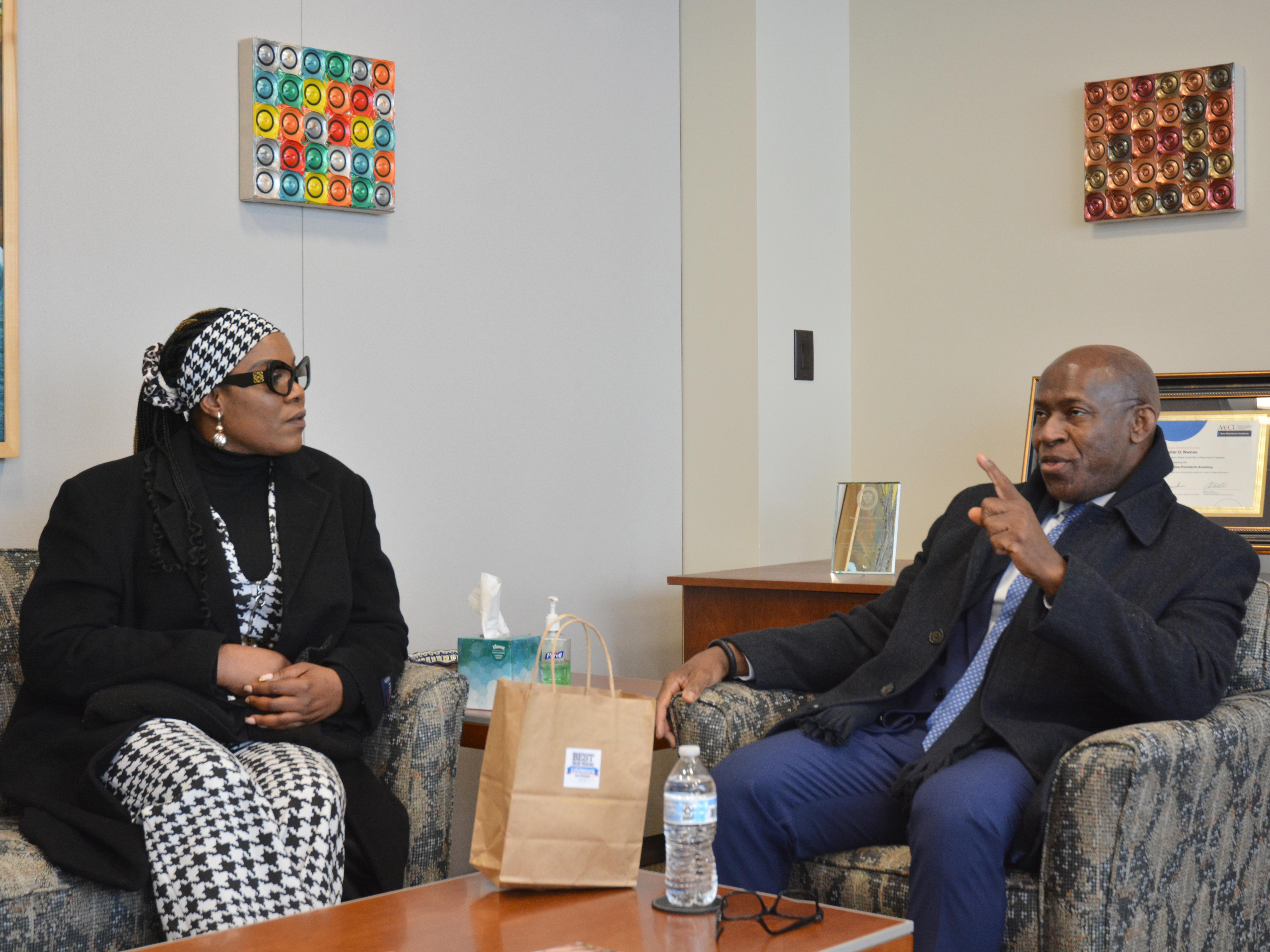 December MBA graduate Jane Nwagu meets with fellow Nigerian native, President Peter O. Nwosu, while visiting in December to celebrate Commencement.