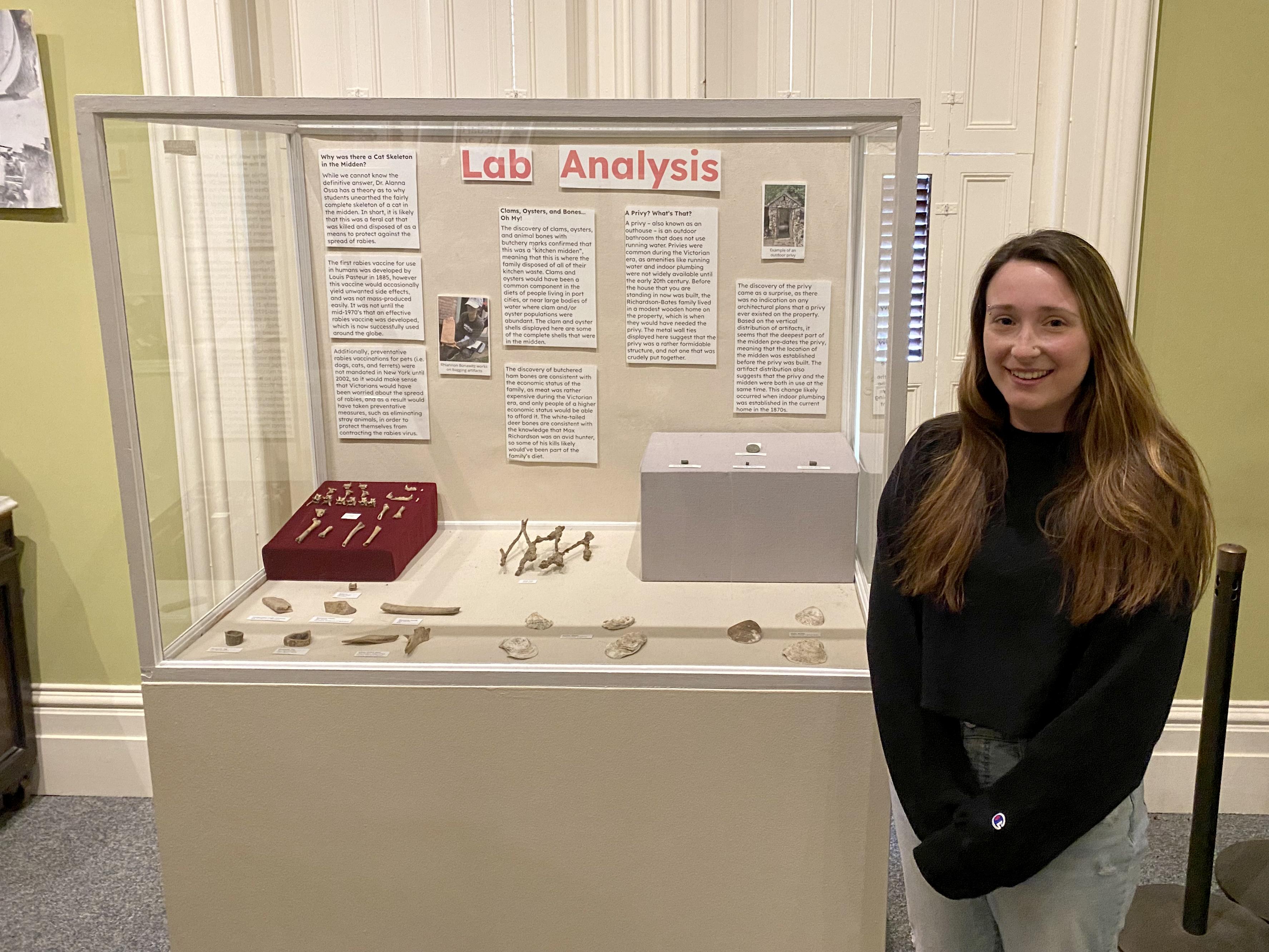 May anthropology graduate Nerissa Conklin shows an exhibition she created at the Richardson-Bates House Museum about the university's field school.