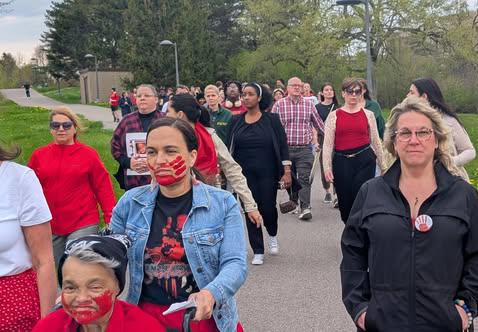 Supporters walk in honor of Red Dress Day, recognizing Missing and Murdered Indigenous Women