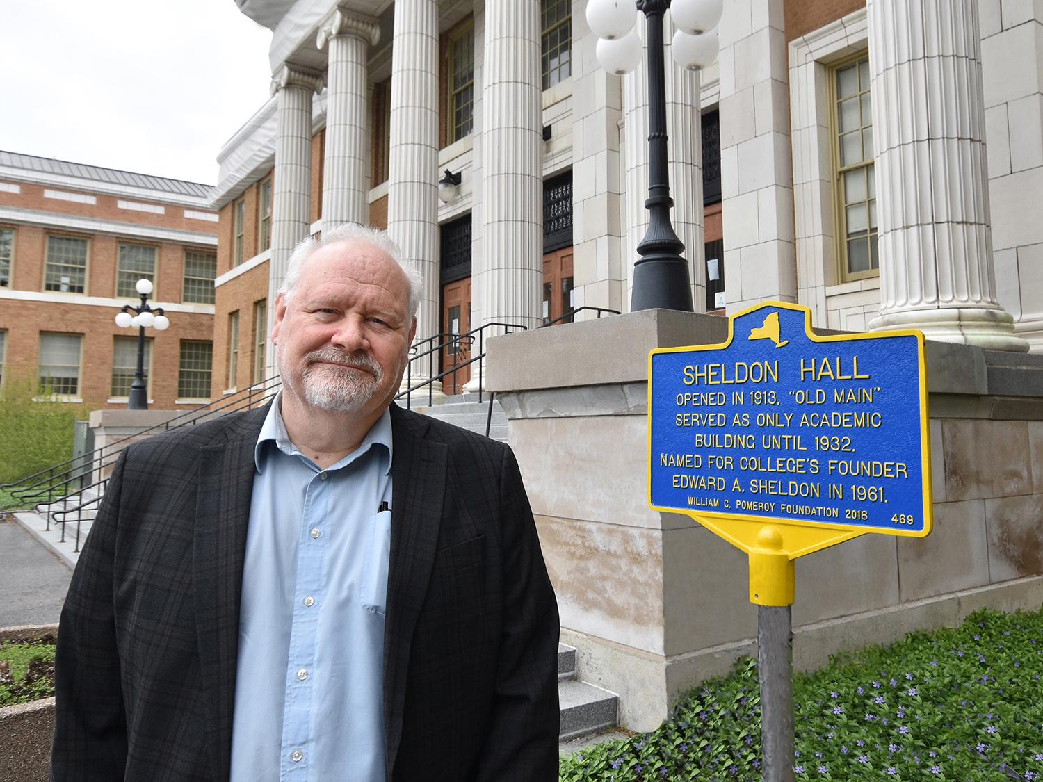 Tyler Art Gallery director Mike Flanagan with historic marker for Sheldon Hall