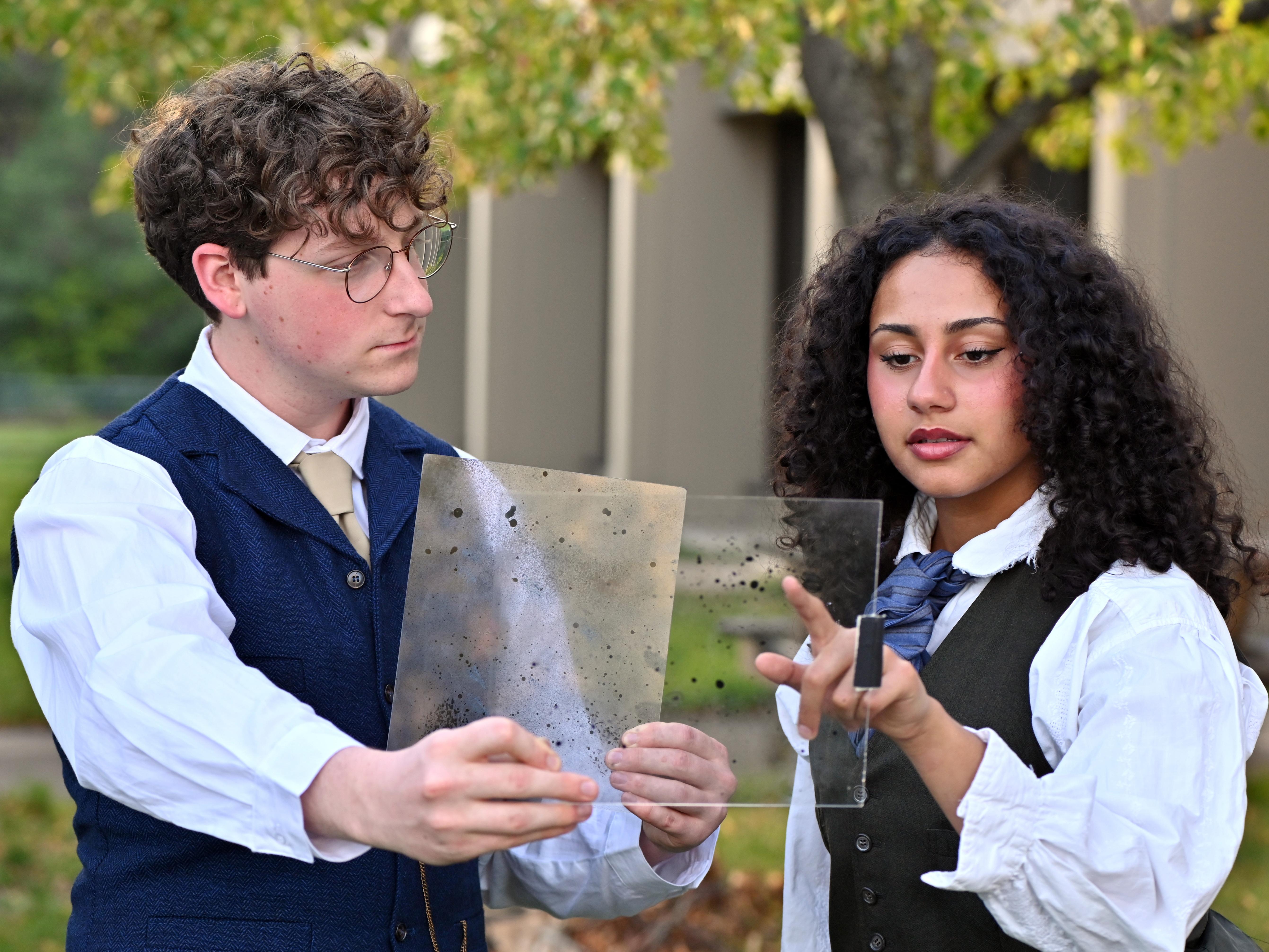 Cameron Humphrey as Peter Shaw and Chelli Lopez as Henrietta Leavitt discuss astronomical discoveries in this rehearsal photo for "Silent Sky."