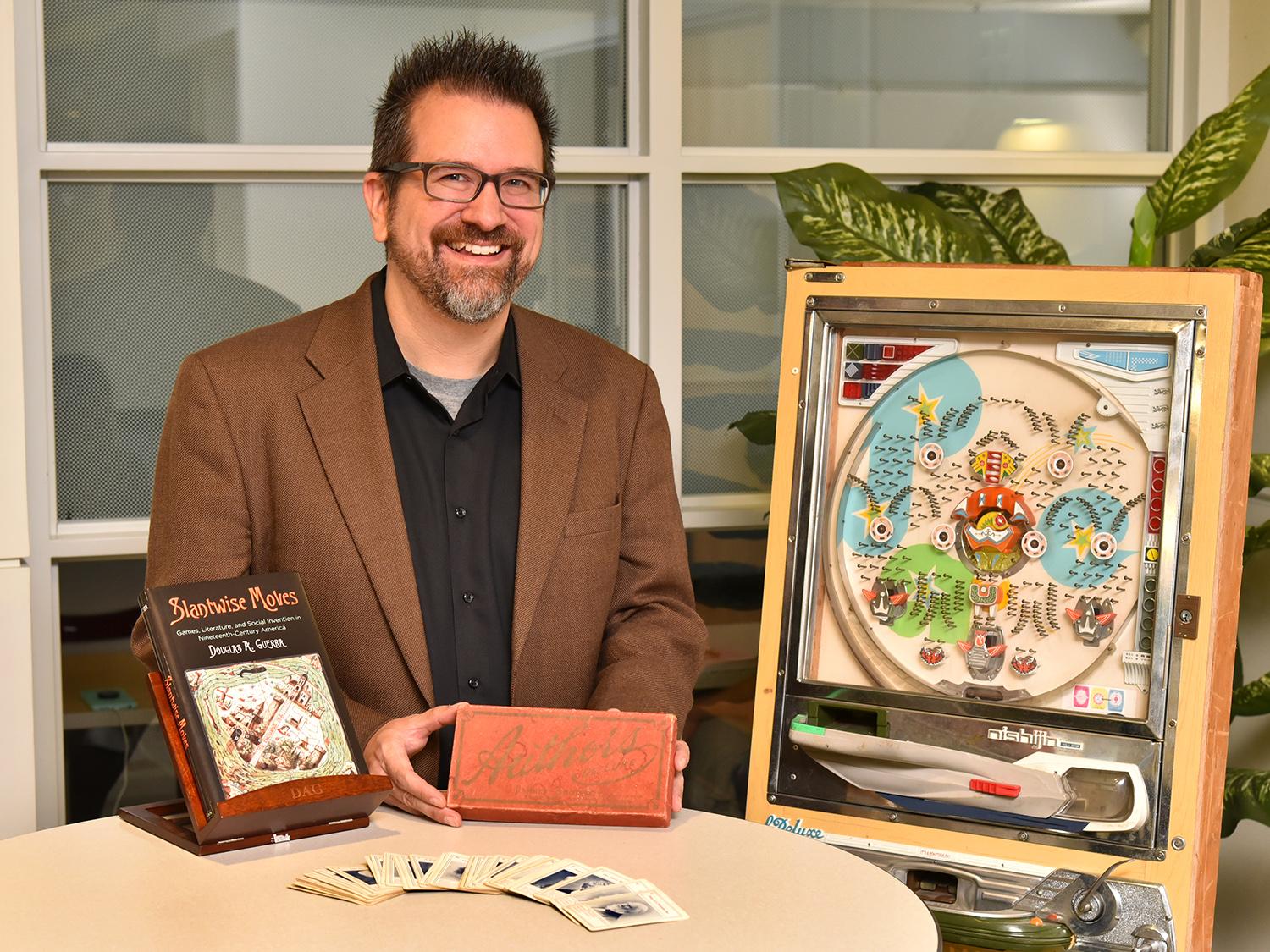 Douglas Guerra of SUNY Oswego’s English and creative writing faculty recently earned the Popular Culture Association’s Ray and Pat Browne Award for his book Slantwise Moves, which connects books, games and 19th-century social lives