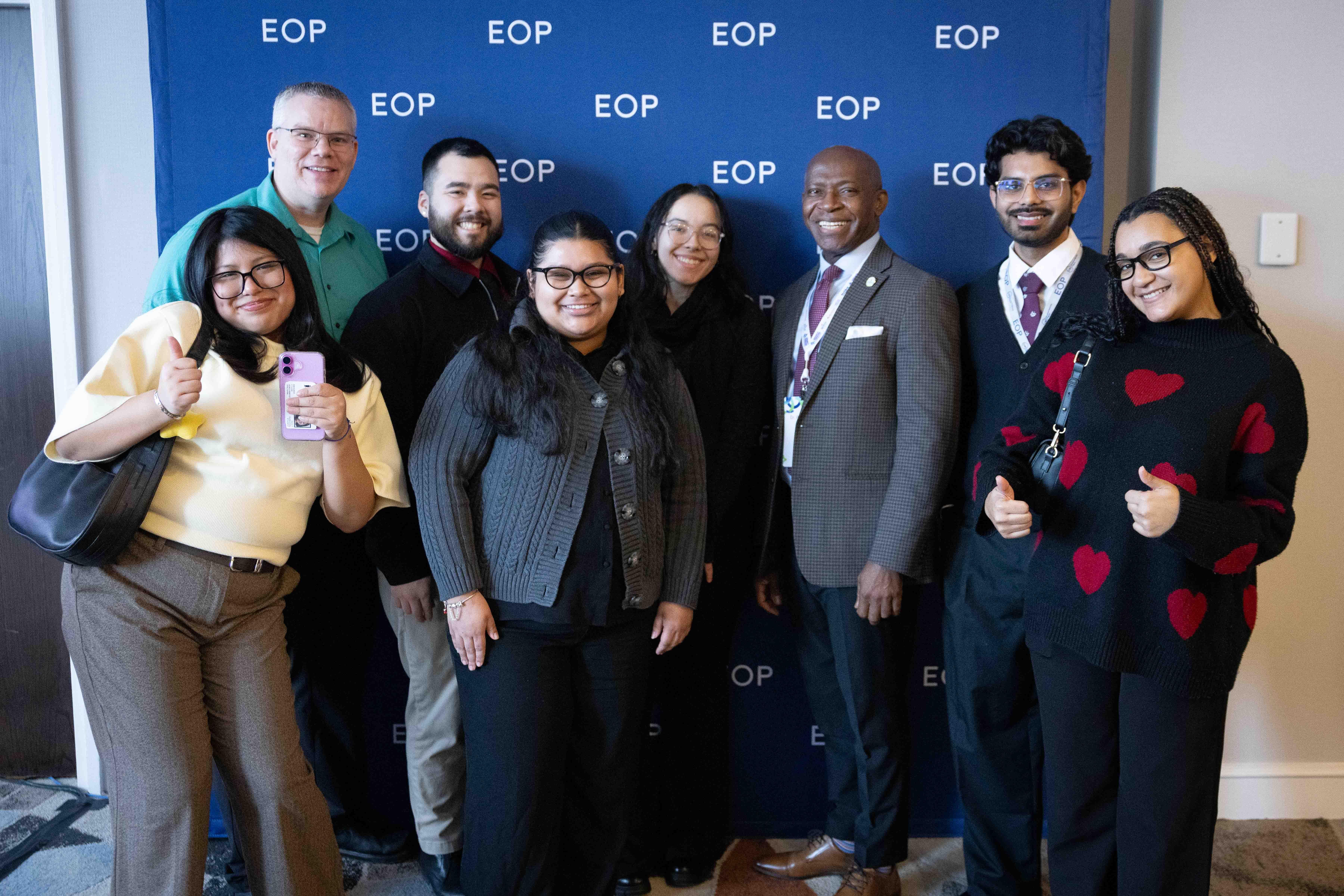 President Nwosu, joined by EOP students and staff, accept an EOP Champion Award