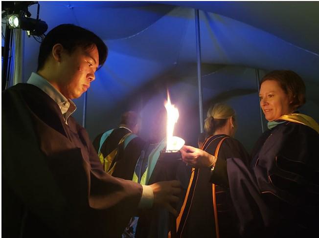 Symbolic passing of the Torch of Knowledge for Torchlight