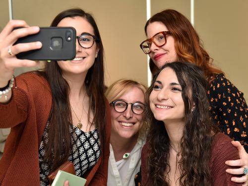 Christene Barberich, global editor-in-chief and co-founder of Refinery29, poses with art students