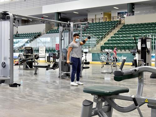 Students use the Fitness Centers relocated into Marano Campus Center arena
