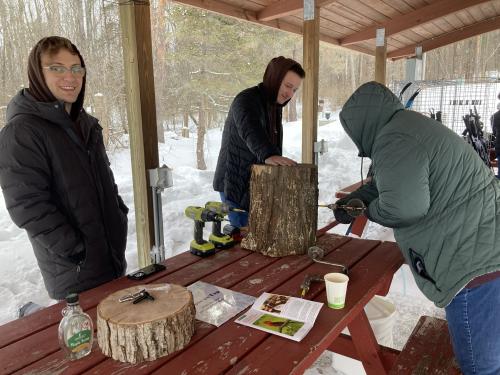 Students show how to drill for sap