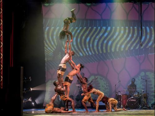 Cirque Kalabante performers stage an amazing acrobatic feat of a man doing a handstand atop a human pyramid