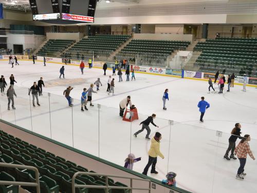 Young people ice skating in Marano Campus Center arena