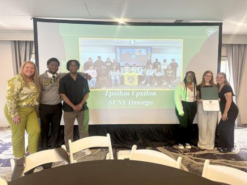 SUNY Oswego representatives celebrate national chapter award