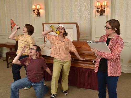 Production image for Fun Home of actors portraying children playing in a funeral home