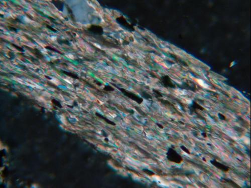 A rock photo was taken by David Valentio using a microscope. The field of view is about 5 millimeters