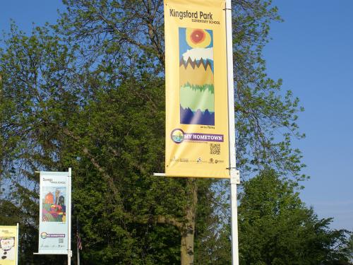 Banners featuring schoolchildren's art near Breitbeck Park