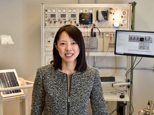 Professor Hui Zhang in lab with computer science and engineering equipment
