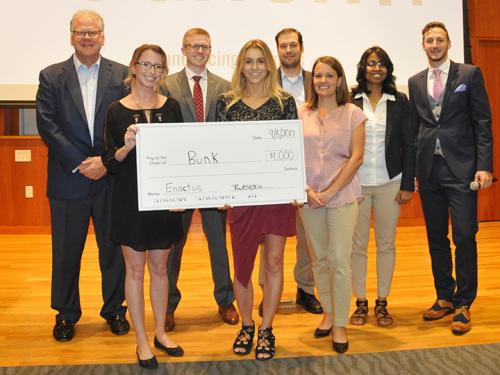 2017 student startup winners with Launch It judges and organizers plus a big check