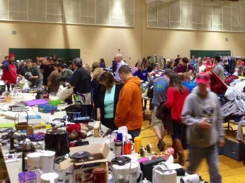 Shoppers browse for bargains on tables during Leave Green sale