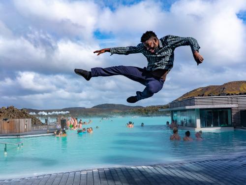 Mic Anthony jumps into the air near Blue Lagoon in Iceland