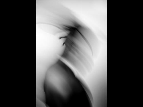 Black and white photo titled Drowning by Liam Morgenstern shows a blurred figure on a white background