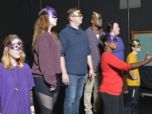 Students in "Acting Shakespeare" class in masks and rehearsing