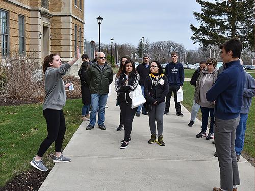Student leads admission tour for families