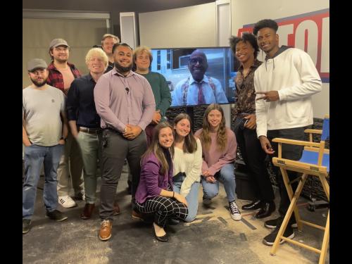 Students on set of OX5 with Al Roker in background on screen 