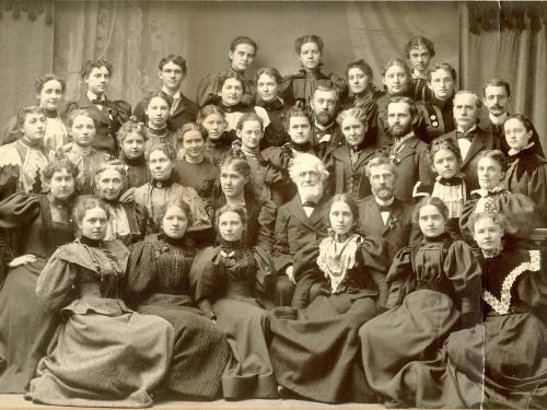 University founder Edward Austin Sheldon, surrounded by a class during the 1890s