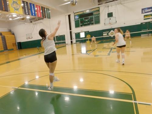 Skylar Bechard serves in a volleyball practice