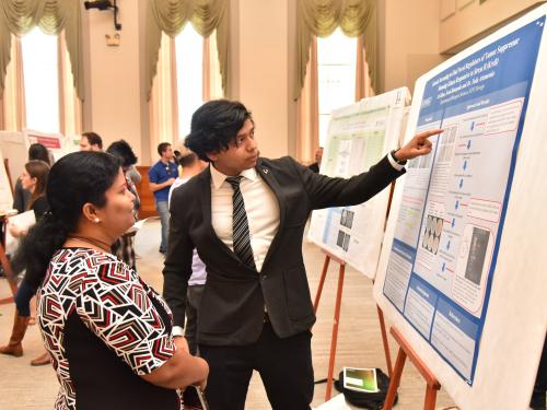 A Summer Scholars student gives a poster presentation